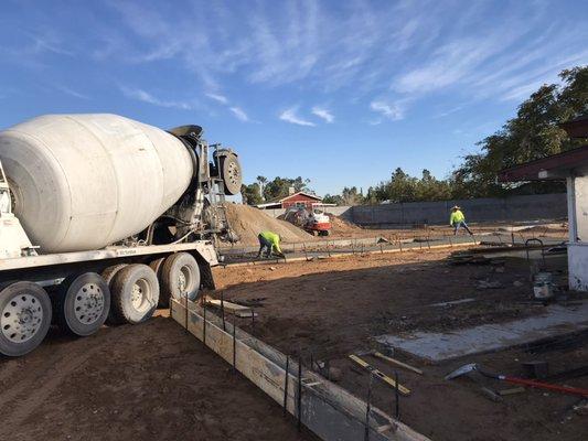 Setting concrete curb in preparation for final grade.