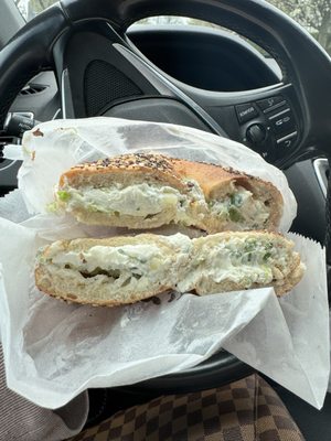 Everything bagel toasted scooped out with scallion cream cheese