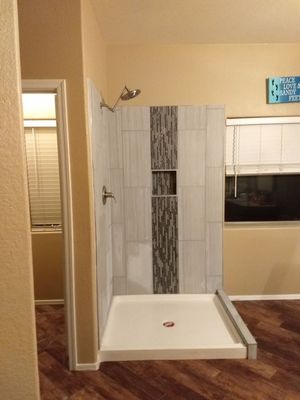 After 2, enlarged tile shower with built in niche