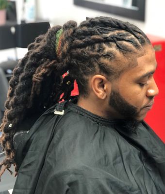 Locs styled in Knot Rope Twists