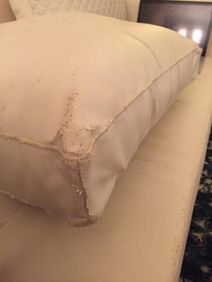 Flaky couch, falling apart in places I didn't think was possible