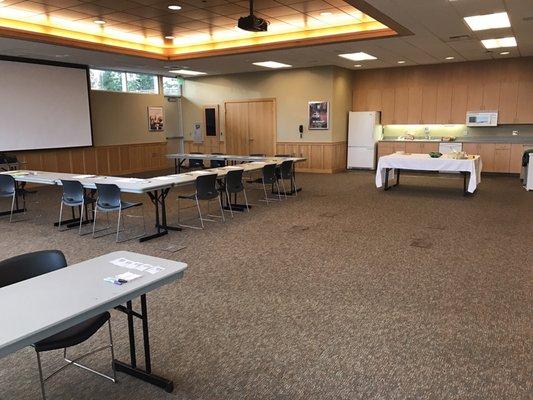 The community room has a kitchen with fridge, microwave, sink, utensils, plates, dishwasher, coffeemaker, etc.