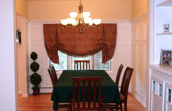 Created larger cased opening between dining room and kitchen. Altered ceiling to be a tray celing.