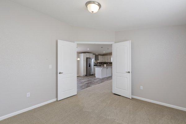 Double doors open up to a spacious and open concept living/kitchen area.