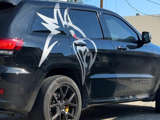 Custom made in Photoshop - designed by us, cut and installed in Grey Avery Vehicle Wrap on this Jeep Trackhawk.