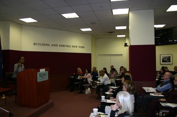 Nicole Beauchamp of Engel and Volkers addresses a packed Mendik Education Center