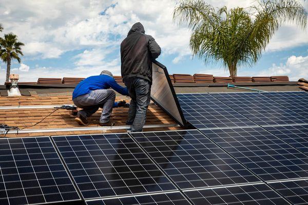 Solar installation on shingle roof, engineered to never cause a leak in your roof.