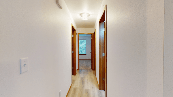 New Drywall/Texture and flooring in hallway during remodel. By Merritt Builders