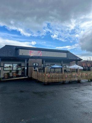 Our outdoor patio has 4 tables with umbrellas with 16 chairs and 8 chairs under the overhang to keep you dry!