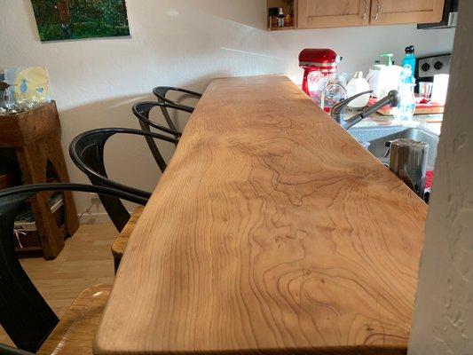 Custom bar in kitchen / dining area. Live edge. Also Himalayan Cedar. Natural finish non-toxic.