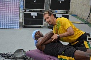 Dr. Douglas Treating Usain Bolt at the Korea World Championships