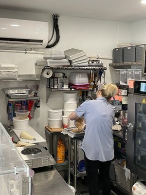 Tracy at work! I ate the second to last oatmeal caramel chocolate bar so she was on it - making a new batch!