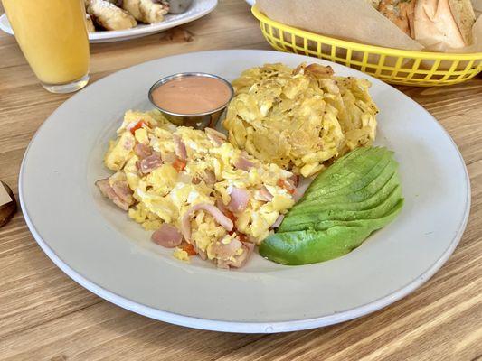 Brunch Sunday- Criollo scrambled served w/ aranitas and avocado.