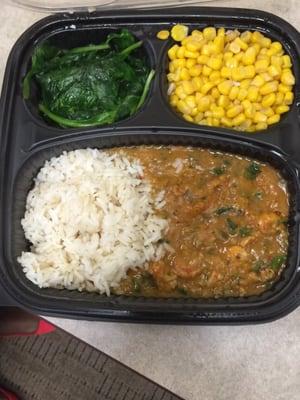 Crawfish étouffée with spinach and corn