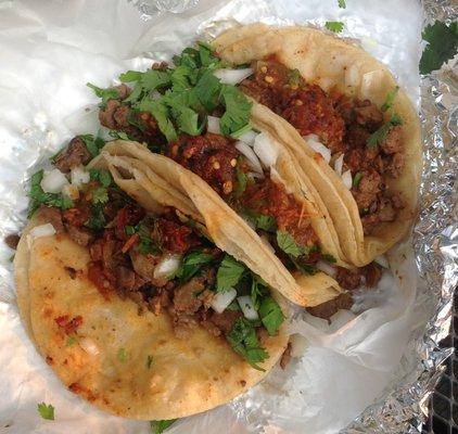 Fantastic carne asada tacos with red sauce: