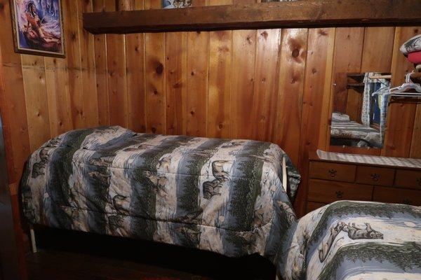 Pinecrest "Wolf" room - 3 comfy twin beds, wolf theme with Original Art and circa 1940's sturdy Army bed frames - so cool!