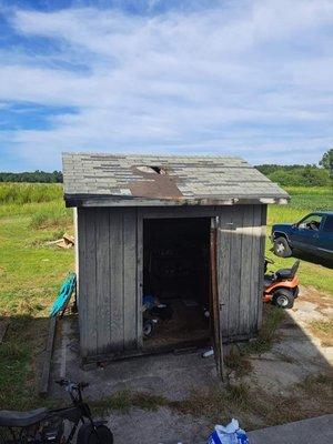 Before photos of a shed that had roof leaks and needed a whole new roof job.