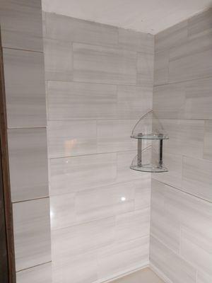 Tile shower. This 24"x12" tile shower came out great. The glass niche in the corner fits just right.