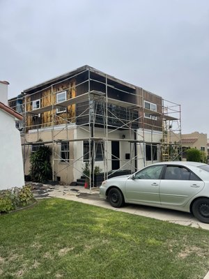 Demo wood siding and stucco