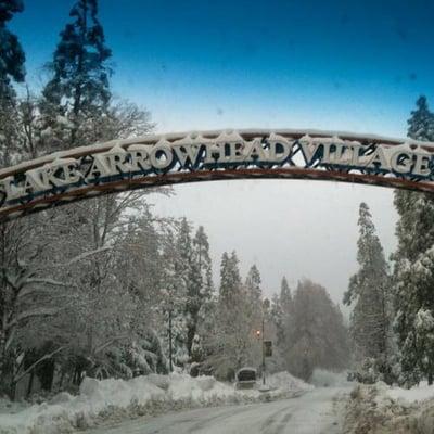 Winter morning welcome to Lake Arrowhead Village.  Simply drive, snow board, ski, or slide through the arch down to our office.