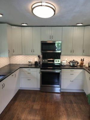 Beautiful job installing soapstone backsplash behind stove.