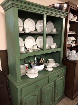 Shabby finish on a Moss Green Hutch. Twelve place setting of China.  One of several sets.