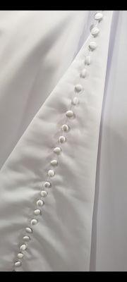 Custom gown with satin buttons