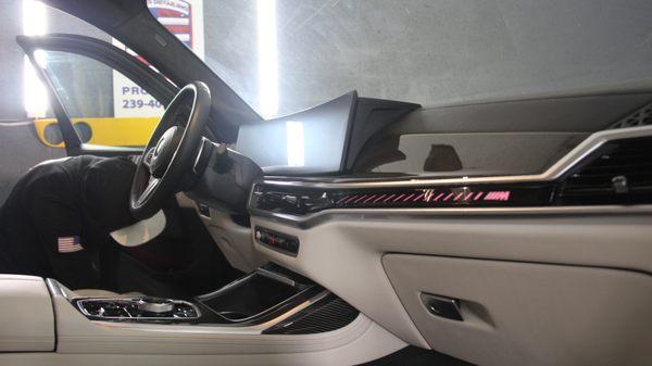 Featured in this photo is our head of operations, Corbin, detailing the interior of a BMW X7 M60.