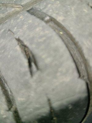 Blurry as it is, if you look deep down into the tear you can see the cord running through the rubber of the tire