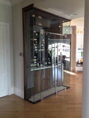 Frameless glass wine cellar, measured, furnished, and installed by Lone Star Glass in 2017