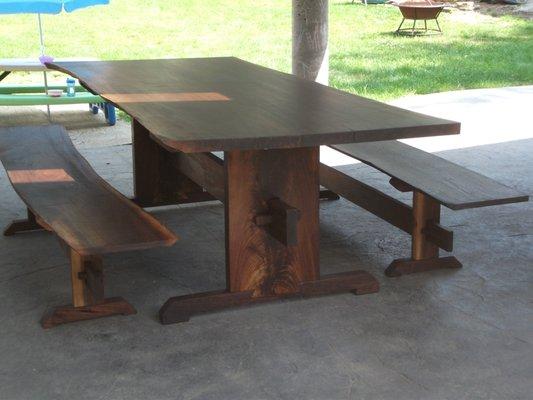 Custom rustic table and benches in walnut.