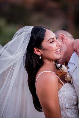 Neck kisses and giggles for the lovely couple.