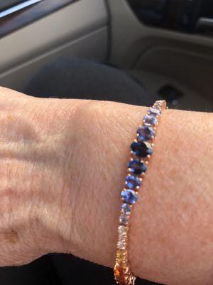 5 color sapphire bracelet in graduated colors and stones set  in pink gold.