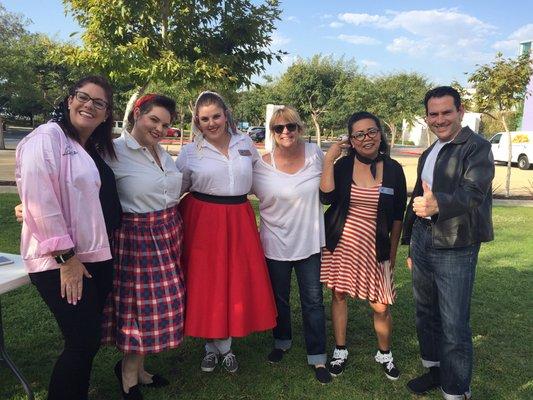 Rabbi Zylberman and staff members getting in the spirit of the Sock Hop Shabbat in the Warsaw Amphitheater