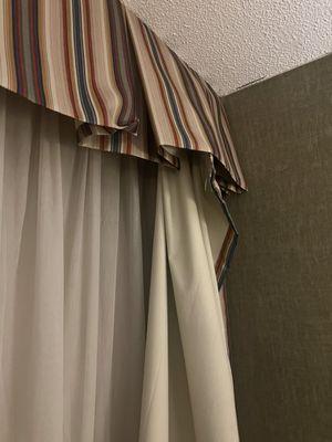 Broken curtains.