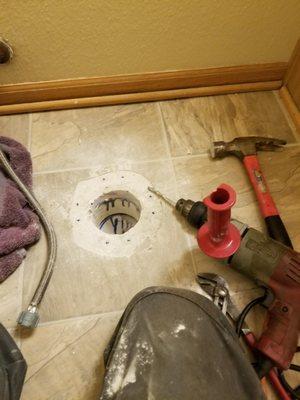 Replacing a toilet flange on the drain