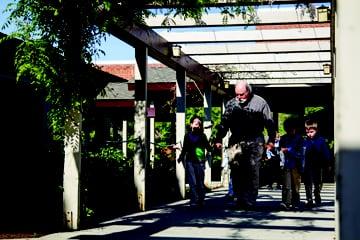 Kindergarteners return from an arts class.