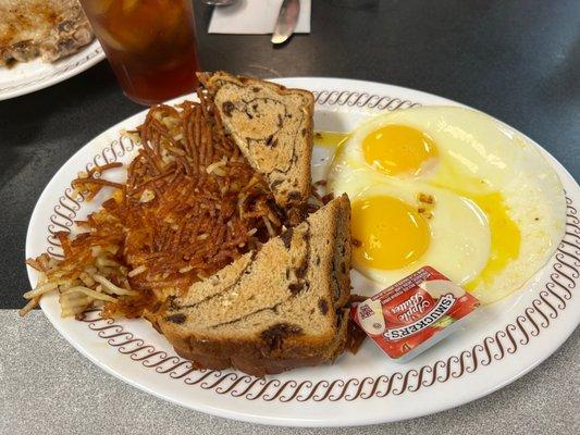 Crispy hash browns raisin toast and sunny runny eggs with apple butter jam