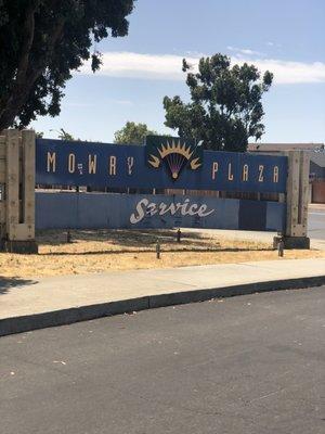 Olde sign at entrance of Lion Plaza