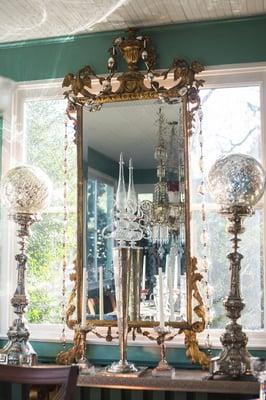 An example of a restored antique framed mirror that has been placed appropriately in its setting. Custom interior design help.