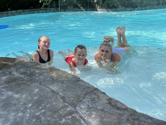 Sisters learning to swim together.