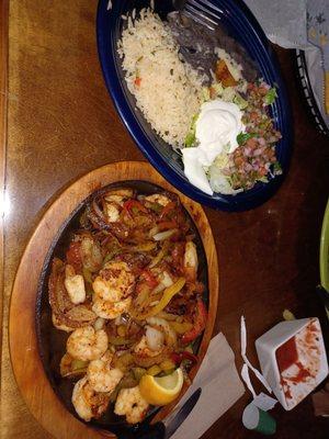 Shrimp fajitas with refried black beans and rice.  Large portion of shrimp and veggies.