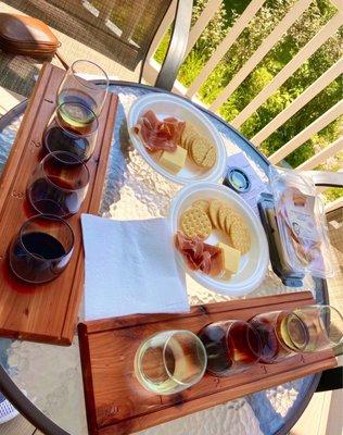 Wine flights, crackers, prosciutto, and cheese