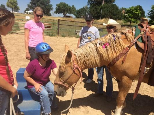 Thanking the horse after Therapeutic Riding at HorseBuds TRC in Greeley, CO