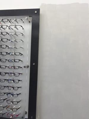 they sort-of pained over where the mirrors used to be...why would there be NO mirrors on the walls of an eyeglass location!?