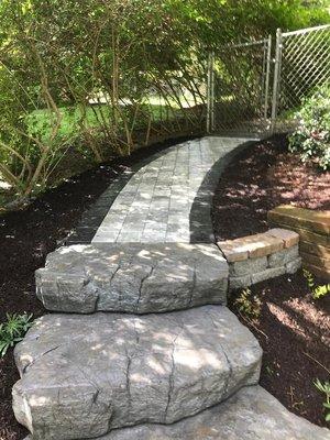 36" walkway, Natural Stone steps. Project improved customer safety.  Durable materials last lifetime.