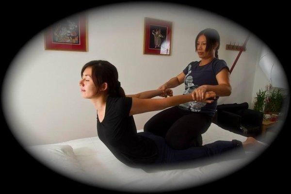 Body stretching with Thai massage techniques.