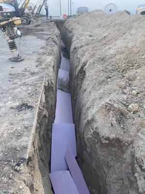 Water service getting insulated under driveway