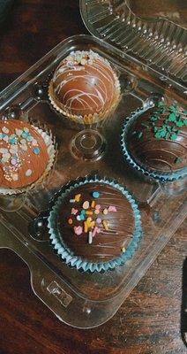 Hot cocoa bombs (top left to right - vanilla cappuccino, mint chocolate, milk chocolate, dark chocolate)