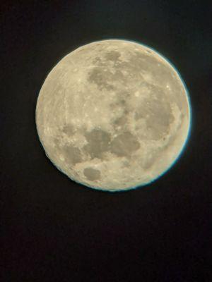 Harvest moon over playa through smokey haze